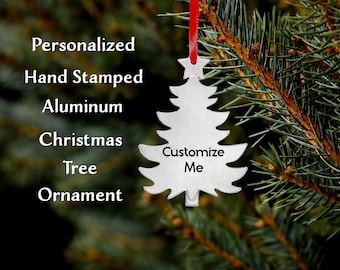 Make your holidays extra special with customized metal hand-stamped ornaments. Hand stamped Christmas Tree Shaped Holiday Tree Ornament