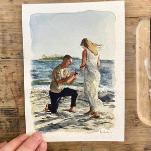 May include: Watercolor painting of a marriage proposal on a beach. A person kneels, presenting a ring to another person standing by the ocean. The artwork features soft blues, greens, and sandy tones, capturing a romantic moment.
