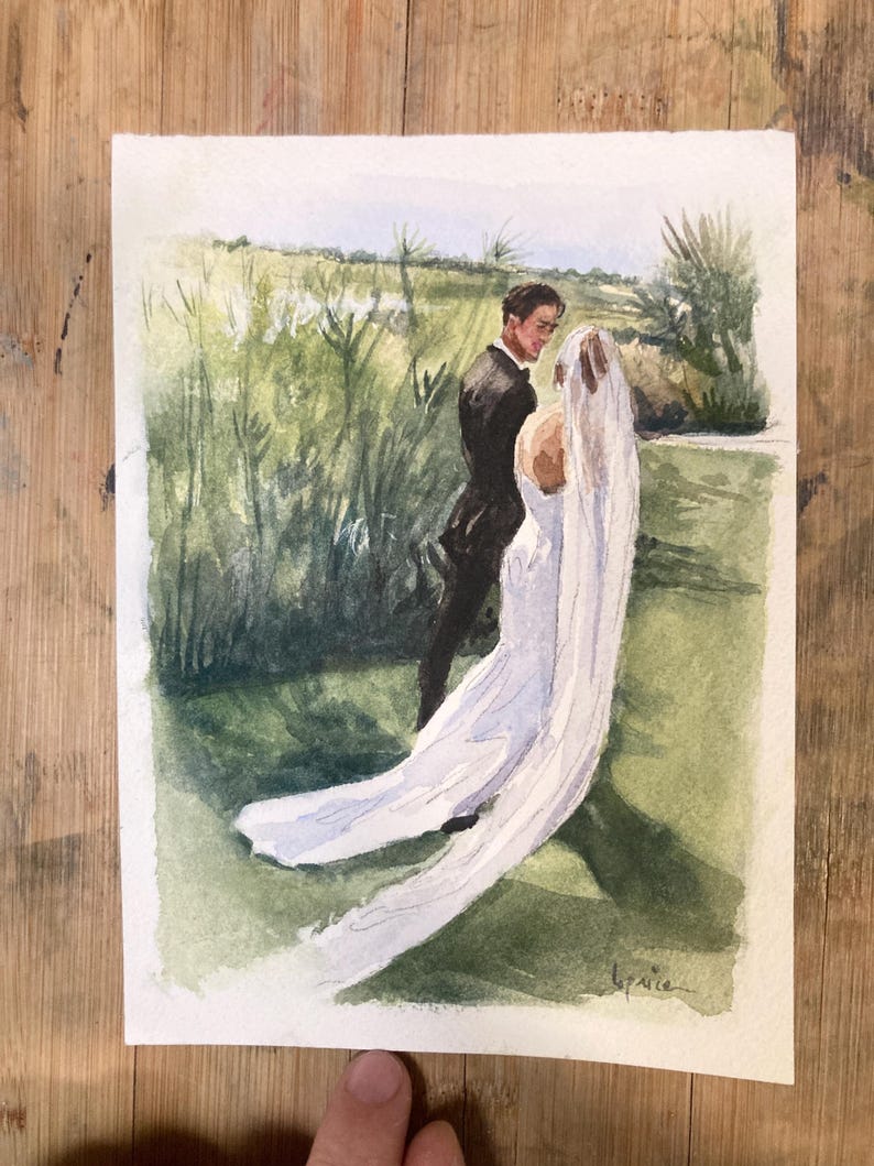 May include: Watercolor painting of a wedding scene. A couple stands in a field of tall green grass. The bride wears a white dress and veil. The groom is in a black suit. The background features a blue sky and green foliage.