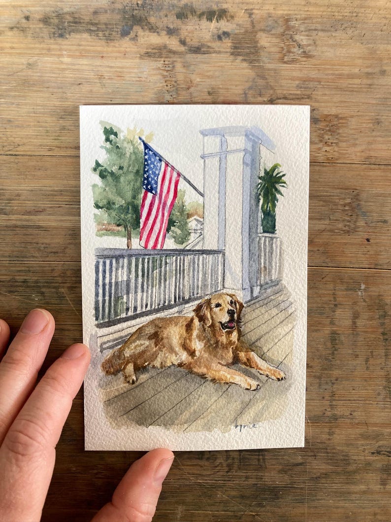 May include: Watercolor painting of a golden retriever dog lying on a wooden deck. An American flag waves in the background, along with a white porch and green trees. The artwork is signed "Bryce".