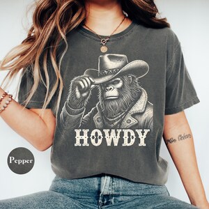 Bigfoot Cowboy Shirt, 100% Cotton Comfort Colors® Shirt, Howdy Shirt, Sasquatch Western Shirt, Funny Bigfoot Gift, Retro Western Graphic Tee