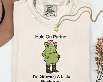 Comfort Colors® Hold On Partner I'm Growing A Little Buckaroo Shirt, Funny Frog Mom Shirt, Pregnancy Announcement, Baby Reveal, Gift for Mom