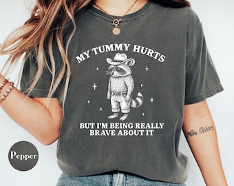 Comfort Colors® My Tummy Hurts But I’m Being Brave About It Shirt, Funny Raccoon Shirt, Vintage Cowboy Western Shirt, Raccoon Humor Gift