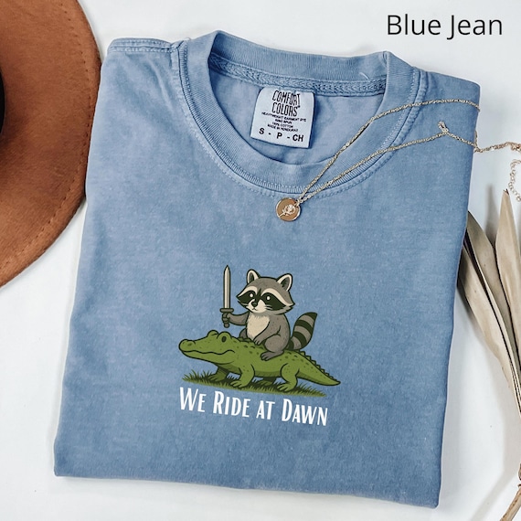 Comfort Colors® Raccoon and Alligator Shirt, We Ride at Dawn Shirt, Funny Whimsical Shirt, Humor Animal Gift, Cottagecore Aesthetic Shirt