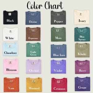May include: A color chart featuring various t-shirt colors, including black, denim, pepper, and ivory. Other colors are white, espresso, moss, blue spruce, chambray, light green, blue jean, khaki, blossom, orchid, violet, berry, yam, mustard, crimson, and grape.