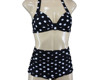 May include: Black and white polka dot bikini with a halter top and high-waisted bottoms.