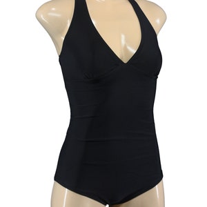May include: A black halter-style swimsuit with a V-neckline.