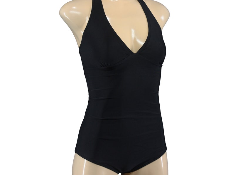 May include: A black halter-style swimsuit with a V-neckline.