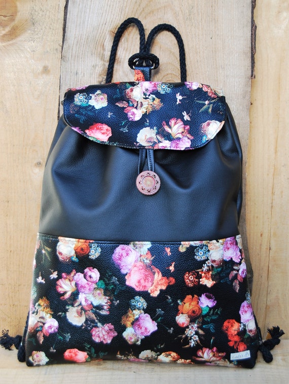 black backpack with flowers