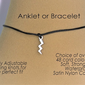 May include: Black adjustable ankle bracelet or bracelet with a silver lightning bolt charm. The cord is made of soft, strong, and waterproof satin nylon.  Choice of over 48 cord colors.