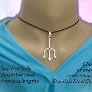 May include: A silver-toned trident pendant featuring a small dark center stone, suspended on a thin black cord. The text on the image reads: Choice of fully adjustable cord or various lengths and Choice of over 48 cord colours or Stainless Steel Chain.