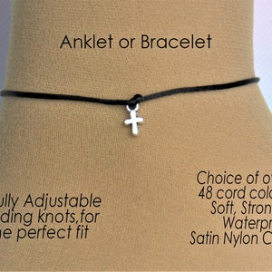 May include: A black adjustable anklet or bracelet with a silver cross charm. The cord is made of satin nylon and is available in over 48 colours. The anklet is fully adjustable with sliding knots for a perfect fit.