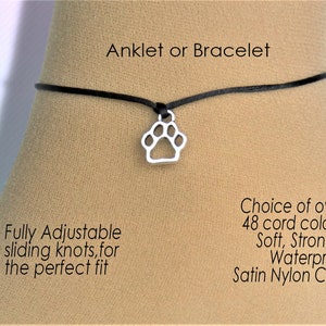 May include: Black adjustable ankle bracelet or bracelet with a silver paw print charm. The cord is soft, strong, and waterproof.  Choice of over 48 cord colors.  Satin nylon cord.