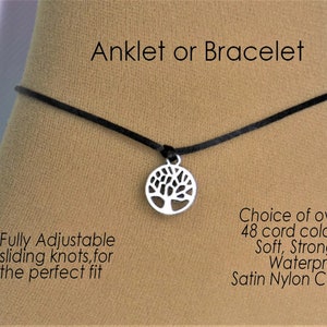 May include: Black adjustable ankle bracelet or bracelet with a silver tree of life charm. The cord is soft, strong, and waterproof.  Choice of over 48 cord colors.