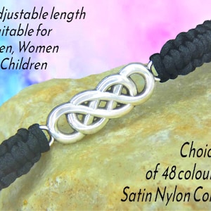 May include: A bracelet featuring a silver-toned infinity symbol centerpiece connected to black braided satin nylon cord. Text on the image reads: Adjustable length Suitable for Men, Women & Children and Choice of 48 colours Satin Nylon Cord.