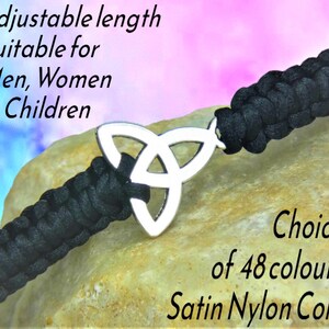 May include: Black satin nylon cord bracelet with a silver Celtic knot charm. The bracelet is adjustable and suitable for all. The image text says "Choice of 48 colours".