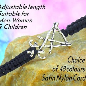 May include: Black satin nylon cord bracelet with a silver-toned charm. The bracelet is adjustable and suitable for all. The image includes text that says "Adjustable length Suitable for Men, Women & Children" and "Choice of 48 colours Satin Nylon Cord."