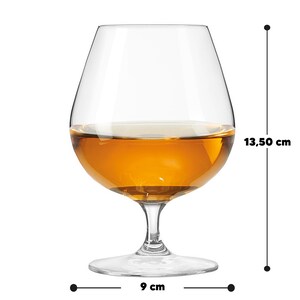 May include: A clear brandy glass filled with amber liquid. The glass measures 13.50 cm in height and 9 cm in width. The glass has a rounded bowl, a stem, and a wide base. The liquid inside appears to be a spirit.