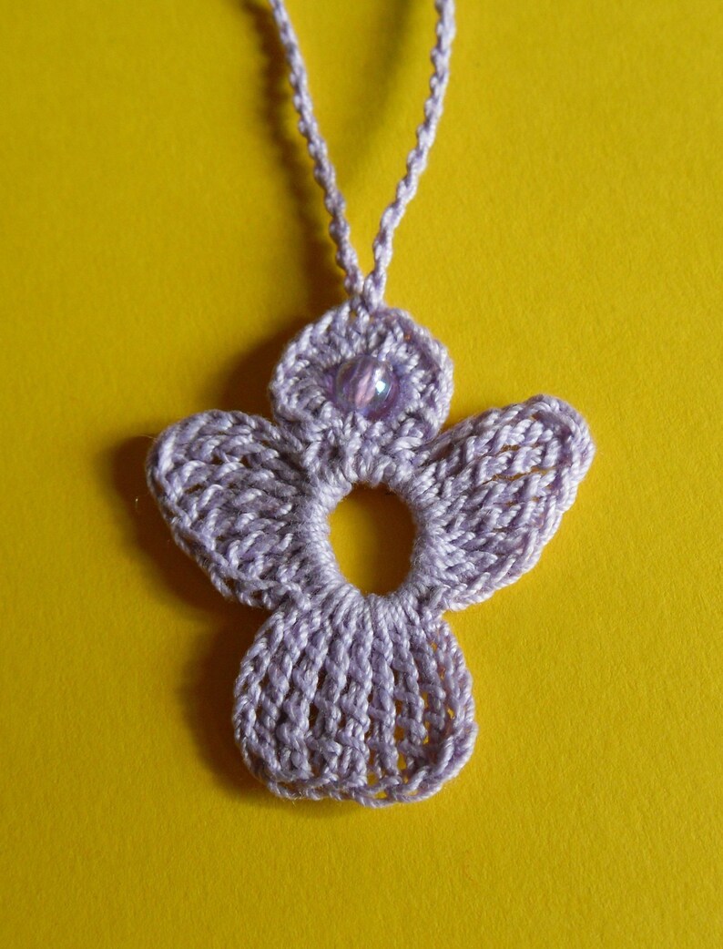 crochet Angel in lilac with light lilac bead