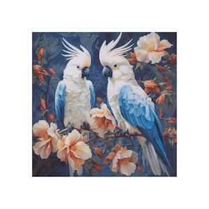 May include: Two white cockatoos with blue wing feathers perched on a branch with pink and white flowers. The cockatoos are facing each other and have black eyes.