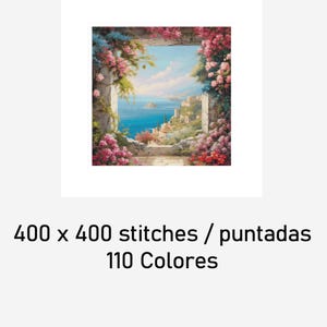 May include: A framed painting depicts a scenic coastal view through a stone archway, adorned with pink and blue flowers. The artwork showcases a vibrant seascape with a town on a hillside. The text at the bottom reads "400 x 400 stitches / puntadas 110 Colores."