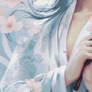 May include: A cross-stitch design featuring a person in a light blue kimono with cherry blossoms. The design has a soft, pastel color palette with pink and white flowers.