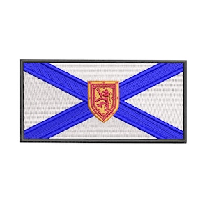 Peut inclure: Un écusson brodé représentant les armoiries de l'Île-du-Prince-Édouard, au Canada. L'écusson est bleu et blanc avec un lion rouge sur un bouclier doré.