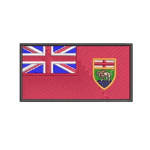 May include: A red and blue embroidered patch with the flag of Manitoba, Canada. The patch features a Union Jack in the upper left corner and the provincial coat of arms in the upper right corner.