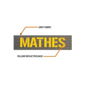 May include: A grey fabric patch with the word "MATHES" in yellow reflective lettering. The patch has a yellow reflective base.