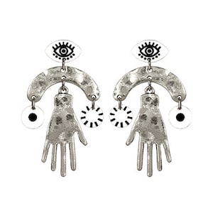 May include: Worn silver earrings with a white eye design, a hand shape, and a circle with black lines. The earrings are in the Worn Silver White color.