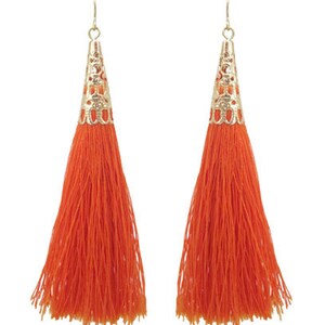 May include: A pair of orange tassel earrings with gold metal accents. The tassels are long and flowing, and the metal accents are intricate and detailed.