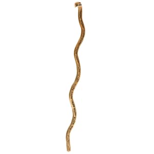 May include: A gold-colored, wavy, metal hair stick with a decorative design.