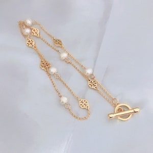 Tory burch toggle necklace deals