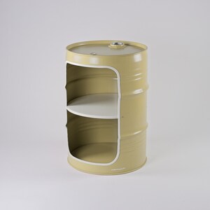 May include: A yellow metal barrel-shaped storage unit with two white shelves. The unit has a large opening on the front with a white trim. The top of the barrel has a small metal fitting. The unit is on a white background.