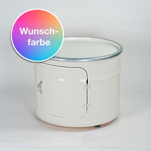 Puede incluir: Un mueble cil&iacute;ndrico de metal en color blanco roto que cuenta con una puerta abatible con tirador y bisagras plateadas. Un gr&aacute;fico circular en la esquina superior izquierda muestra un degradado de arco&iacute;ris con el texto blanco "Wunsch-farbe".