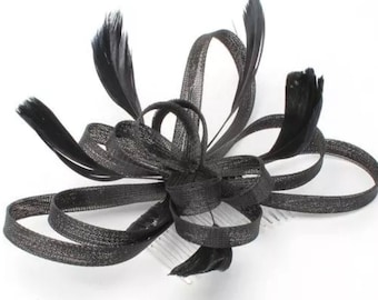 Black Coiled Net And Feather Fascinator On A Clear Comb