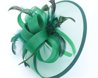 Green net and feather fascinator on an aliceband