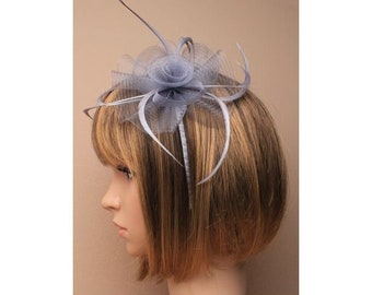 Silver grey centre net flower and feather fascinator on a matching coloured satin covered narrow aliceband