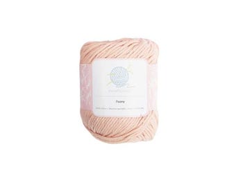 May include: A ball of pale pink cotton yarn with a label that reads "MindfulYarn" and "Peony".