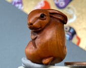 1 Hand carved Boxwood ojime of a rabbit, wood bunny bead, year of the Hare, signed by artist