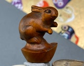 1 Hand carved Boxwood ojime of a rabbit with a gold nugget, wood bunny bead, year of the Hare, signed by artist