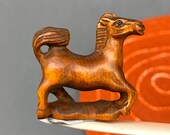 1 Hand carved Boxwood ojime of a standing horse, year of the horse, signed by artist