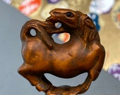 1 Hand carved Boxwood ojime of a horse, year of the horse, signed by artist