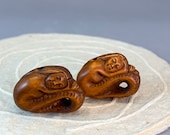 2 Hand carved Boxwood ojime of Japanese mythical animal, mermaid, sleeping mermaid