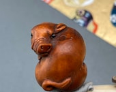 1 Hand carved Boxwood ojime of a pig, wood boar bead, year of the boar, signed by artist
