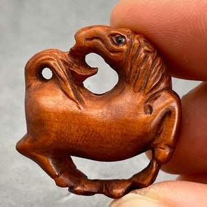 1 Hand carved Boxwood ojime of a horse, year of the horse, signed by artist