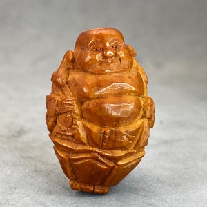 Estate Sale: hand carved olive pit bead of a happy buddha, massive olive pit of a standing happy buddha, represents happiness and prosperity