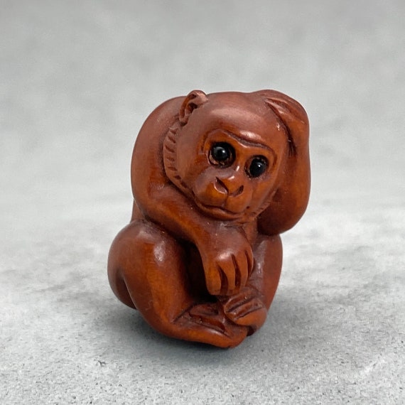 signed by the artist One hand carved boxwood ojime: Monkey symbol of prosperity and wisdom wood monkey bead year of the monkey