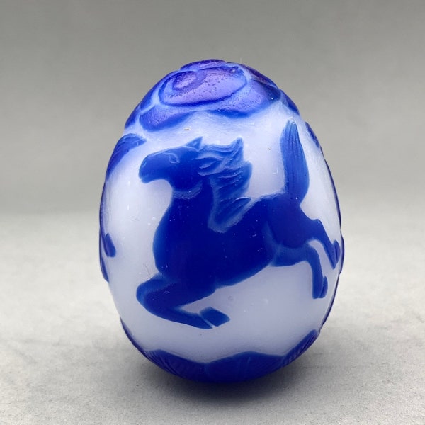 Vintage Peking glass egg of overlay blue monochrome horse design, blue horse on white ground Peking glass ornament