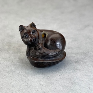 One hand carved teakwood ojime: cat, dark wood cat bead, wood cat bead, fine details, wood cat toggle, hand carved and signed by the carver